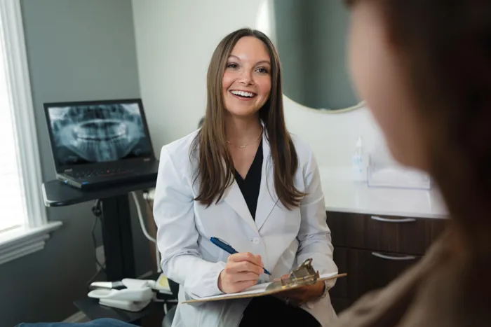 A consultation in progress at Pearly White Dentistry.